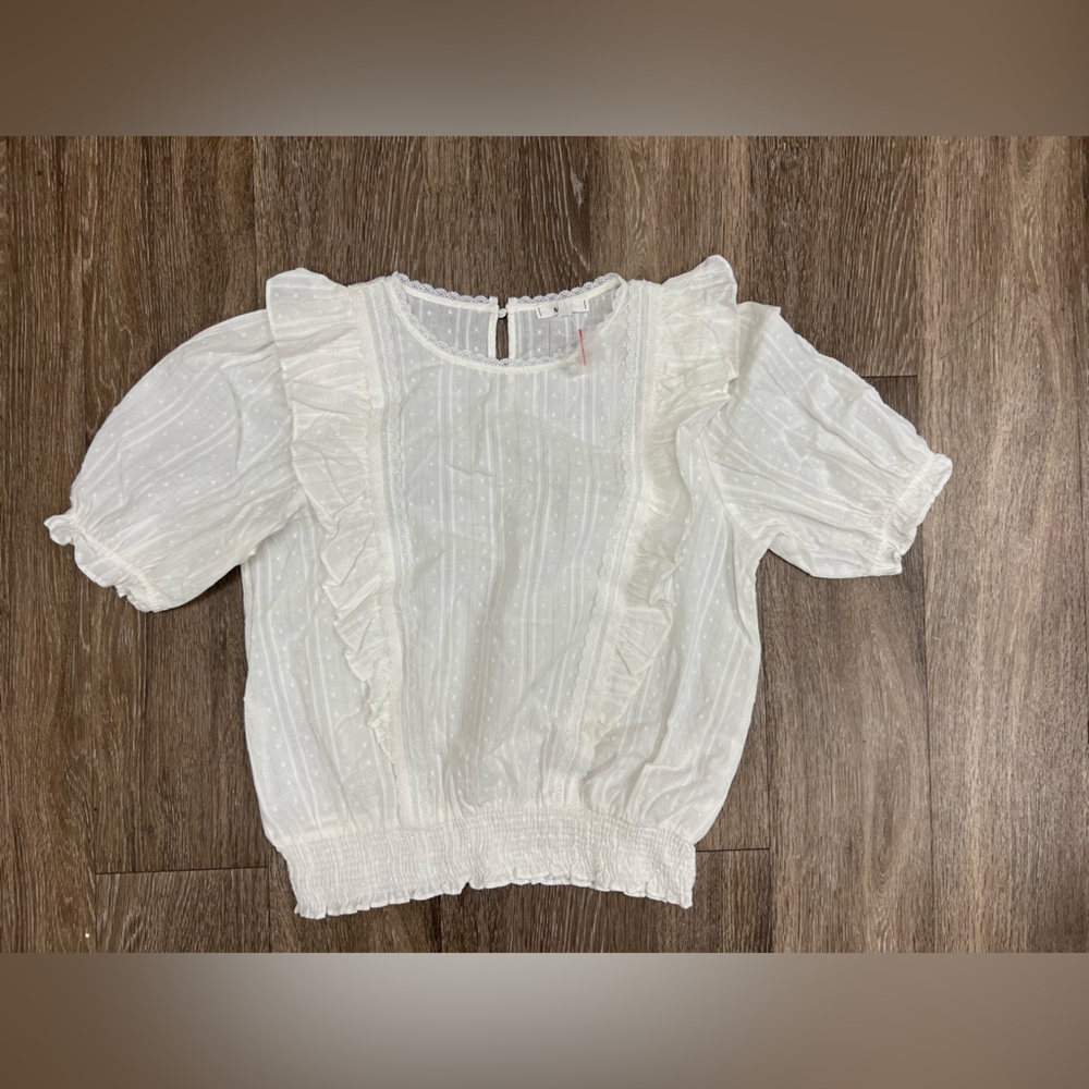 NWOT Size large MINE brand white beautiful blouse.  Never worn.